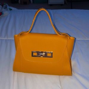 Golden-yellow, small purse with gold lock.